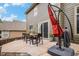 Outdoor patio area with a dining table, chairs, and a shade umbrella for comfortable outdoor dining at 11681 Night Heron Dr, Parker, CO 80134