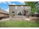Expansive backyard features a stone patio, landscaped garden beds, and a well-maintained lawn at 11681 Night Heron Dr, Parker, CO 80134