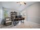 This office includes a comfortable chair, large shelving unit, and a spacious desk area at 11681 Night Heron Dr, Parker, CO 80134