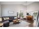 Spacious living room with high ceilings, ample seating, and hardwood floors at 11681 Night Heron Dr, Parker, CO 80134