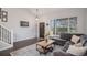 Open living room with vaulted ceiling, large windows, and comfortable seating at 11681 Night Heron Dr, Parker, CO 80134