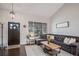 Open living room with vaulted ceiling, large windows, and comfortable seating at 11681 Night Heron Dr, Parker, CO 80134