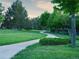 Enjoy a paved walking path winding through the lush, green spaces and mature trees in the community at 11681 Night Heron Dr, Parker, CO 80134