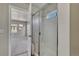 Bathroom featuring glass enclosed shower with seating and a double sink vanity at 12833 Mayfair Way # F, Englewood, CO 80112