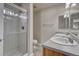 Bright bathroom featuring a double sink vanity and glass enclosed shower at 12833 Mayfair Way # F, Englewood, CO 80112