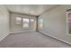 Bright bedroom boasts neutral colors and multiple windows offering ample natural light at 12833 Mayfair Way # F, Englewood, CO 80112