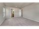 Carpeted bedroom featuring neutral colors with ensuite bathroom access at 12833 Mayfair Way # F, Englewood, CO 80112