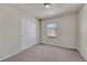 Bedroom with carpet, neutral walls, closet, and window at 12833 Mayfair Way # F, Englewood, CO 80112
