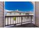 View of multi-story townhomes with attached garages from private balcony at 12833 Mayfair Way # F, Englewood, CO 80112