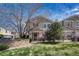 Exterior view of the townhouse, showing the yard and street at 12833 Mayfair Way # F, Englewood, CO 80112