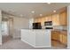 Kitchen featuring wooden cabinets, black appliances, laminate countertops and an open concept floorplan at 12833 Mayfair Way # F, Englewood, CO 80112