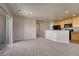 Open concept living area leading to the kitchen and outdoor patio at 12833 Mayfair Way # F, Englewood, CO 80112