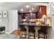 Kitchen island with seating and a view into the dining area at 9397 Las Ramblas Ct # A, Parker, CO 80134