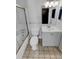 Clean bathroom with a shower-tub combo, white vanity, and neutral tile flooring at 2639 S Xanadu Way # B, Aurora, CO 80014