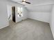 Large bedroom with neutral carpet, ceiling fan and large window at 2639 S Xanadu Way # B, Aurora, CO 80014