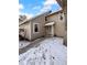Charming townhome featuring a quaint front entrance and walkway lined with landscape lighting at 2639 S Xanadu Way # B, Aurora, CO 80014