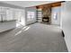 Open-concept living area with a cozy fireplace and a seamless flow to the kitchen at 2639 S Xanadu Way # B, Aurora, CO 80014