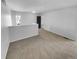 Open loft space with neutral carpet flooring and freshly painted white walls at 2639 S Xanadu Way # B, Aurora, CO 80014