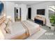 A stylish main bedroom with an ensuite bathroom and modern furnishings for a relaxing retreat at 2639 S Xanadu Way # B, Aurora, CO 80014
