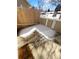 A partially snow covered patio with a wood fence and concrete floor at 2639 S Xanadu Way # B, Aurora, CO 80014
