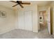 Bedroom with closet and doorway leading to the hall at 15555 E 40Th Ave # 30, Denver, CO 80239