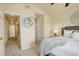 Comfortable bedroom featuring soft carpeting, a ceiling fan, and an open view into the hallway at 15555 E 40Th Ave # 30, Denver, CO 80239