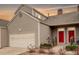 Charming home exterior with a two-car garage and a well-maintained front yard at 15555 E 40Th Ave # 30, Denver, CO 80239