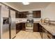 Spacious kitchen featuring stainless steel appliances and beautiful countertops at 15555 E 40Th Ave # 30, Denver, CO 80239