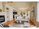 Inviting living room featuring a fireplace, modern decor, and an open floor plan at 15555 E 40Th Ave # 30, Denver, CO 80239