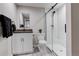 Modern bathroom with a sleek glass-enclosed shower and a vessel sink at 6506 Merrimack Dr, Castle Pines, CO 80108