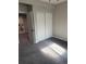 Bedroom with gray carpet and large closet with sliding doors at 6506 Merrimack Dr, Castle Pines, CO 80108