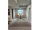 Dining area with a round table and seating for four, lit by recessed lighting at 6506 Merrimack Dr, Castle Pines, CO 80108