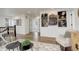Hallway with wood floors, leading to bedrooms, with unique train artwork on the walls at 6506 Merrimack Dr, Castle Pines, CO 80108