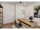 Bright home office featuring wood floors, a neutral rug, and a stylish writing desk and chair at 6506 Merrimack Dr, Castle Pines, CO 80108