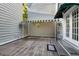 A quaint back porch with flowers, an awning and a wooden floor at 4505 S Yosemite St # 125, Denver, CO 80237