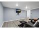 Basement media room with mounted television and seating at 4505 S Yosemite St # 125, Denver, CO 80237