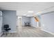 Spacious finished basement with gray walls, stairs, table and chair, and access to the laundry area at 4505 S Yosemite St # 125, Denver, CO 80237