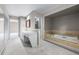 Spacious bathroom featuring a soaking tub and double vanity at 4505 S Yosemite St # 125, Denver, CO 80237