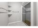 Clean and modern bathroom with glass shower and shelving at 4505 S Yosemite St # 125, Denver, CO 80237
