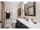 Bathroom with modern sink, framed mirror, and decorative brown patterned shower curtain at 4505 S Yosemite St # 125, Denver, CO 80237