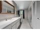 Bright bathroom with a large mirror and vanity with storage at 4505 S Yosemite St # 125, Denver, CO 80237