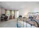 Bright bedroom featuring a comfortable bed, a work desk and beautiful window views at 4505 S Yosemite St # 125, Denver, CO 80237
