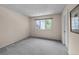 Cozy bedroom with plush carpeting and bright window views at 4505 S Yosemite St # 125, Denver, CO 80237