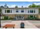Charming clubhouse with stone accents, well-manicured landscaping, and inviting bench seating at 4505 S Yosemite St # 125, Denver, CO 80237
