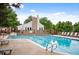 Relaxing community pool area with lounge chairs and mature landscaping at 4505 S Yosemite St # 125, Denver, CO 80237