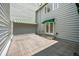 Large wooden deck outside with french doors and a retractable green and white awning at 4505 S Yosemite St # 125, Denver, CO 80237