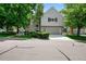 Charming two-story home with a gray exterior, well-manicured landscaping, and an attached two-car garage at 4505 S Yosemite St # 125, Denver, CO 80237