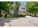 Charming two-story home with a gray exterior, well-manicured landscaping, and an attached two-car garage at 4505 S Yosemite St # 125, Denver, CO 80237