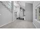 Bright foyer with a staircase, chandelier, balcony, leading to a bright carpeted living area at 4505 S Yosemite St # 125, Denver, CO 80237