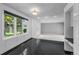 Kitchen view showcasing black tile flooring, a large window overlooking the yard, and ample natural light at 4505 S Yosemite St # 125, Denver, CO 80237
